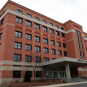 Exterior view of CharterCARE Hospital amidst financial uncertainty