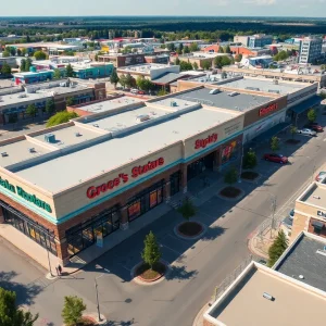 Aerial view of a grocery-anchored retail center bustling with activity.