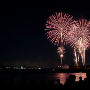 Colorful fireworks illuminating the night sky during 4th of July celebrations in Rhode Island.
