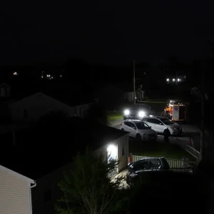 Central Falls homes during power outage with utility workers
