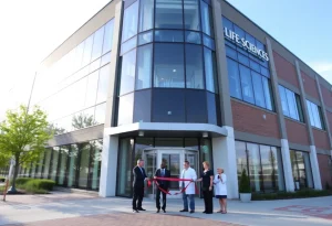 Exterior view of the new life sciences building during the ribbon-cutting ceremony.