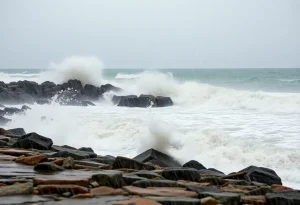Stormy weather impacting the coastline of Rhode Island with heavy rainfall and high waves.