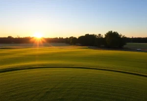 Players competing at a golf tournament with spectators in the background.