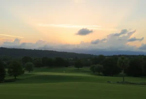 A serene sunset casts a warm glow over a golf course, symbolizing love and community.